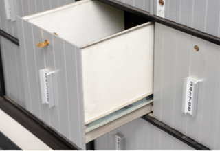 Image of the Large PO Box, Size 4, seen open and empty.